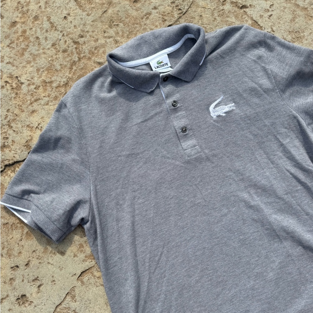 Lacoste polo shirt. SS. Sz 7. Men’s grey w white trim.